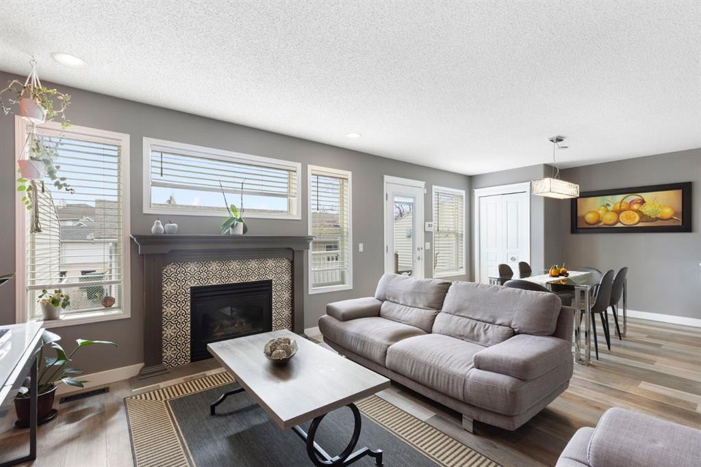 18 West Springs Gate Sw, Calgary, AB - Indoor Photo Showing Living Room With Fireplace
