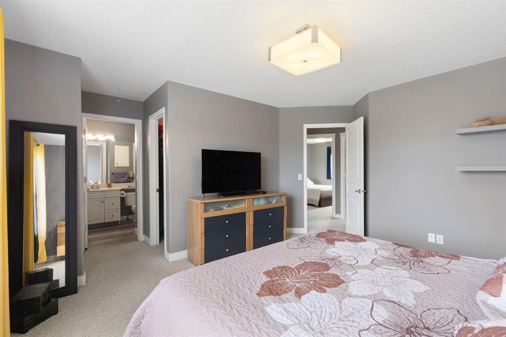 18 West Springs Gate Sw, Calgary, AB - Indoor Photo Showing Bedroom