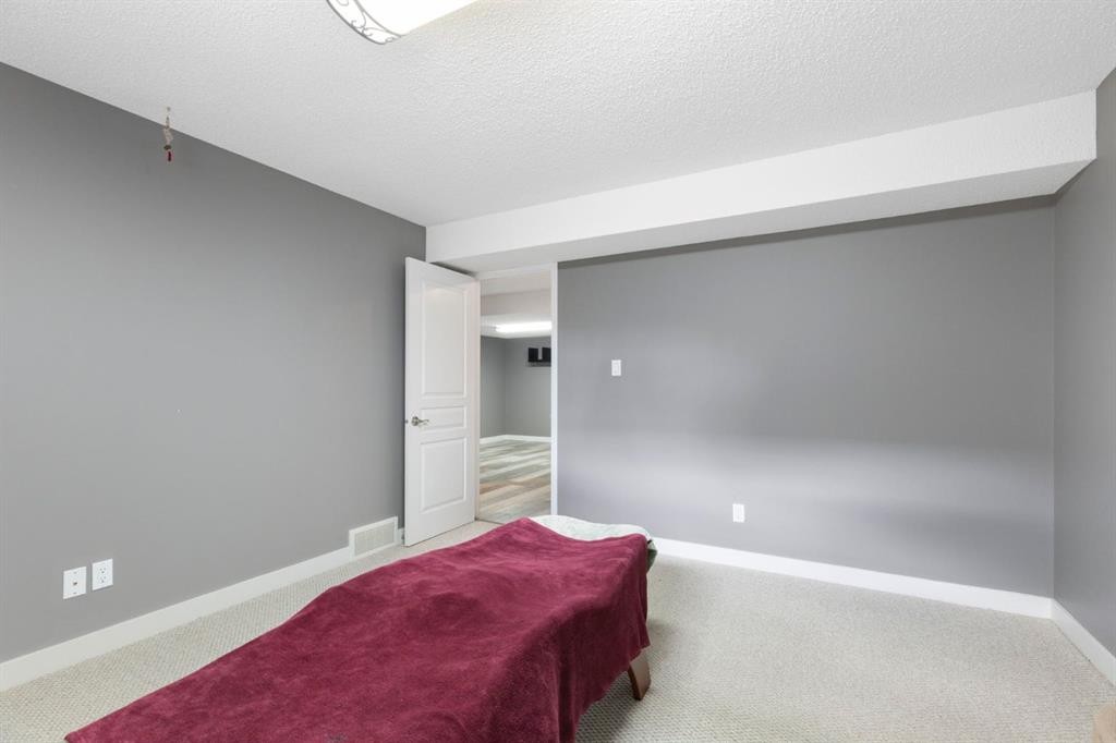 18 West Springs Gate Sw, Calgary, AB - Indoor Photo Showing Bedroom