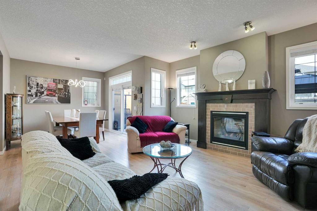 109 Cranleigh Place Se, Calgary, AB - Indoor Photo Showing Living Room With Fireplace