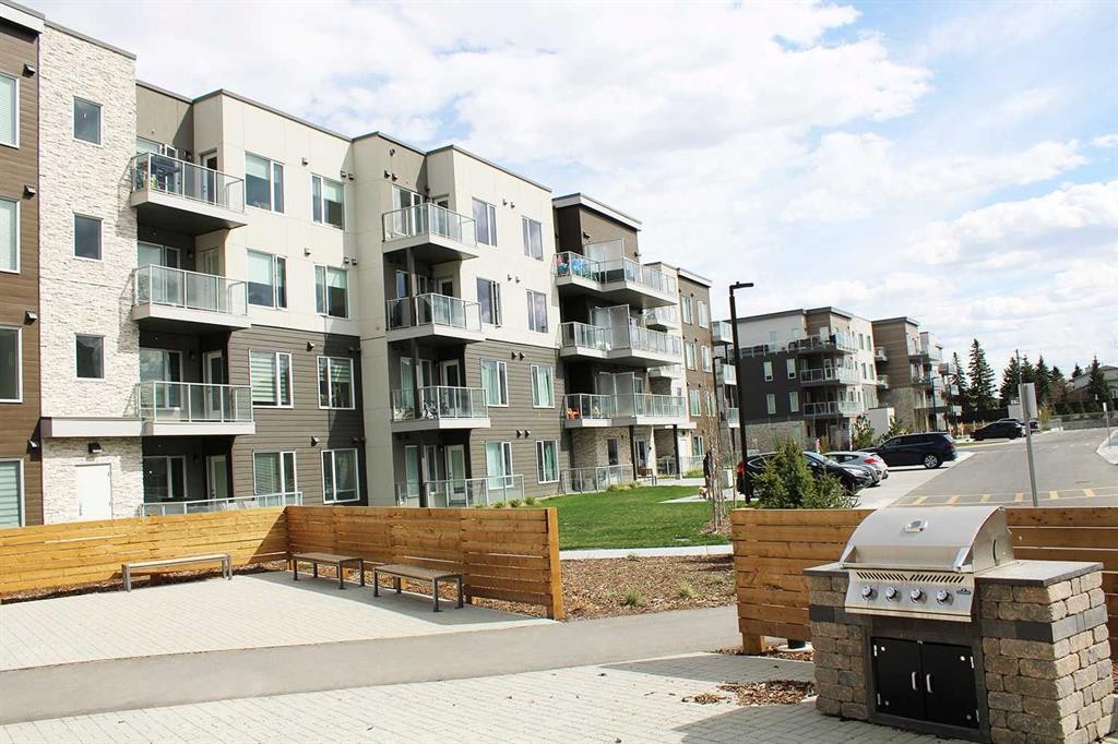 205-700 Shawnee Square Sw, Calgary, AB - Outdoor With Balcony With Facade