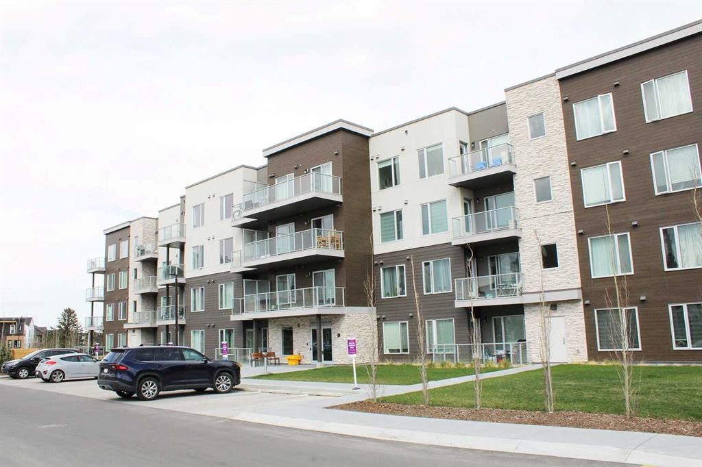 205-700 Shawnee Square Sw, Calgary, AB - Outdoor With Balcony With Facade