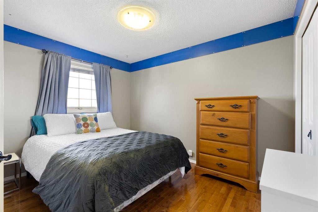1030 Mckenzie Lake Bay Se, Calgary, AB - Indoor Photo Showing Bedroom