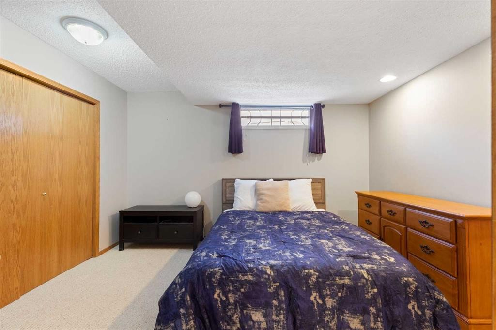 1030 Mckenzie Lake Bay Se, Calgary, AB - Indoor Photo Showing Bedroom