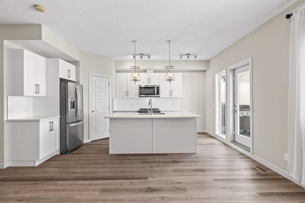310-32 Red Embers Parade Ne, Calgary, AB - Indoor Photo Showing Kitchen With Stainless Steel Kitchen With Double Sink With Upgraded Kitchen
