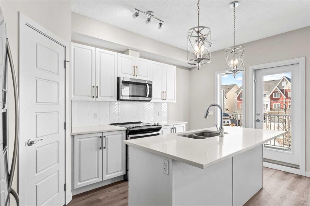 310-32 Red Embers Parade Ne, Calgary, AB - Indoor Photo Showing Kitchen With Double Sink With Upgraded Kitchen