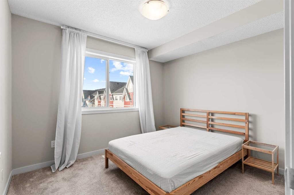 310-32 Red Embers Parade Ne, Calgary, AB - Indoor Photo Showing Bedroom