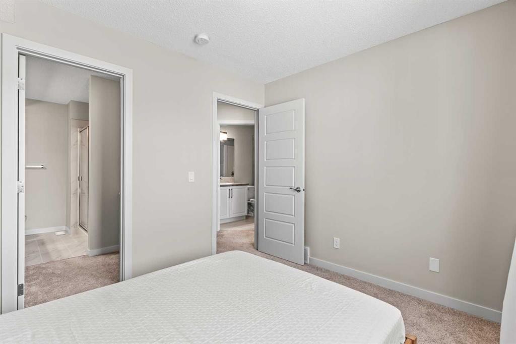 310-32 Red Embers Parade Ne, Calgary, AB - Indoor Photo Showing Bedroom