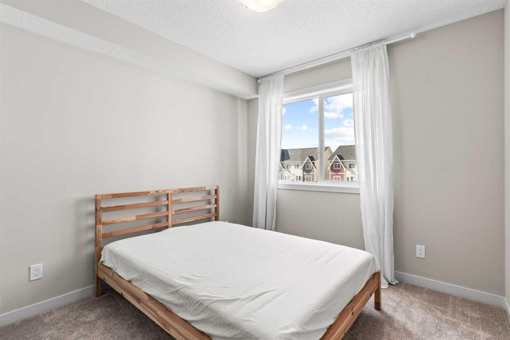 310-32 Red Embers Parade Ne, Calgary, AB - Indoor Photo Showing Bedroom
