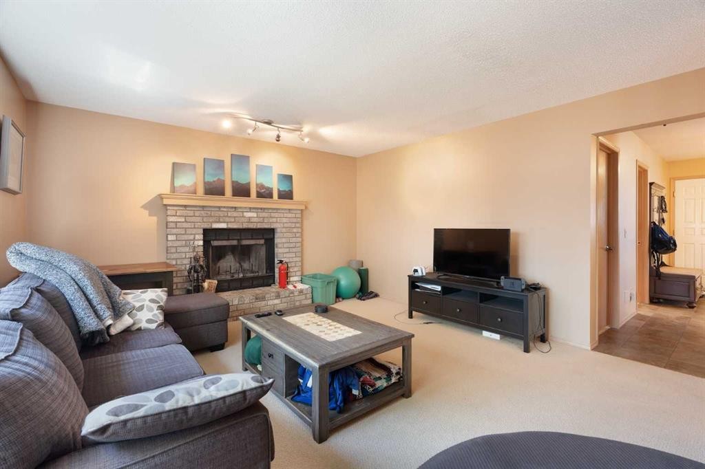 113 Sierra Vista Terrace Sw, Calgary, AB - Indoor Photo Showing Living Room With Fireplace