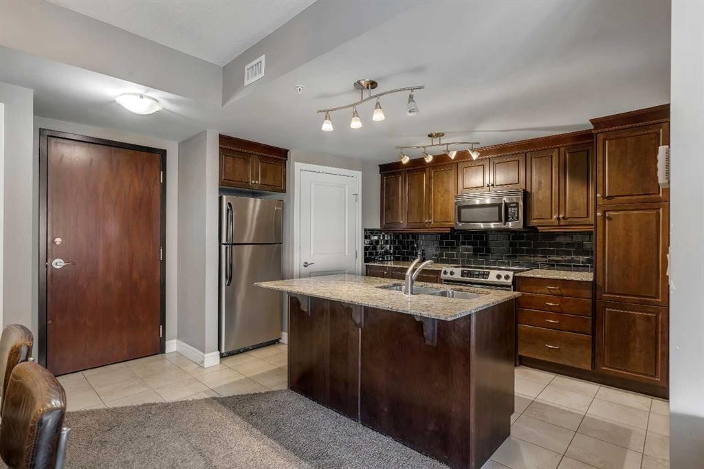 2402-910 5 Avenue Sw, Calgary, AB - Indoor Photo Showing Kitchen With Stainless Steel Kitchen With Double Sink