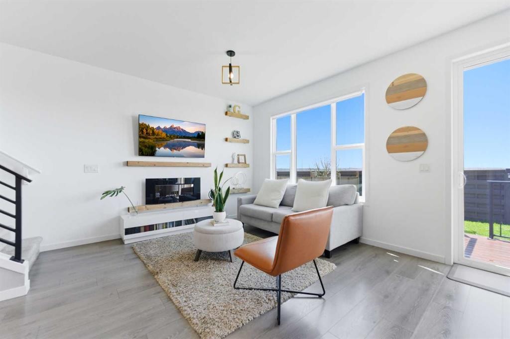 912 Seton Circle Se, Calgary, AB - Indoor Photo Showing Living Room With Fireplace