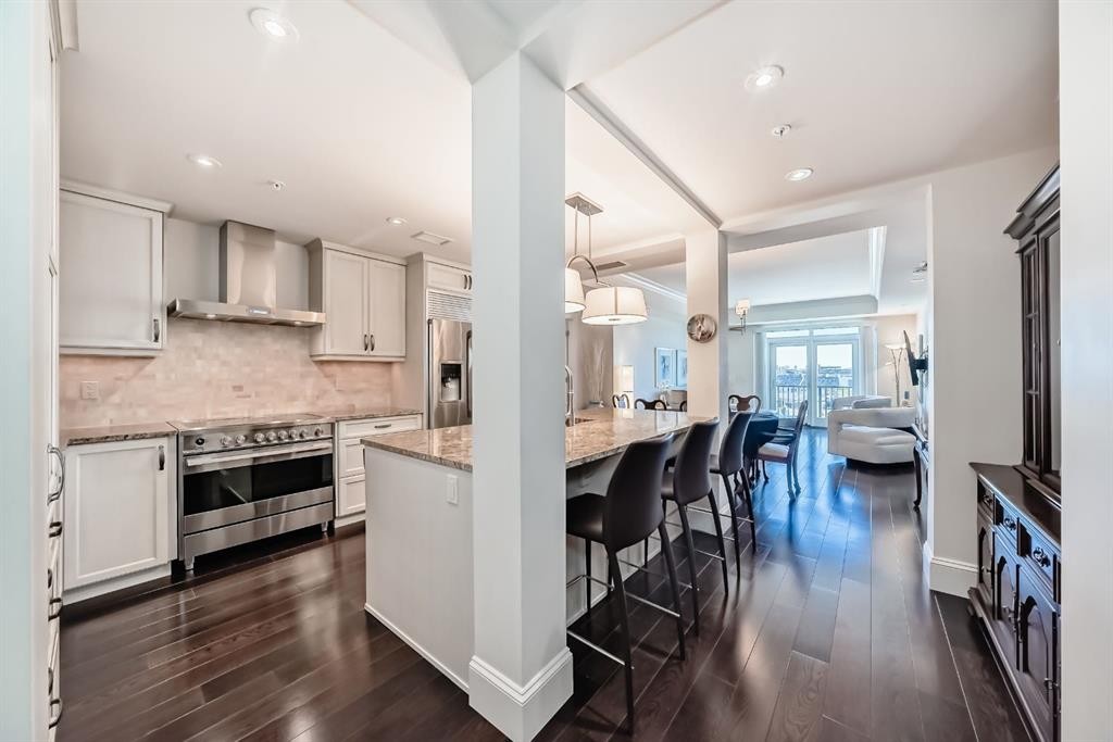 404-211 Quarry Way Se, Calgary, AB - Indoor Photo Showing Kitchen With Stainless Steel Kitchen With Upgraded Kitchen