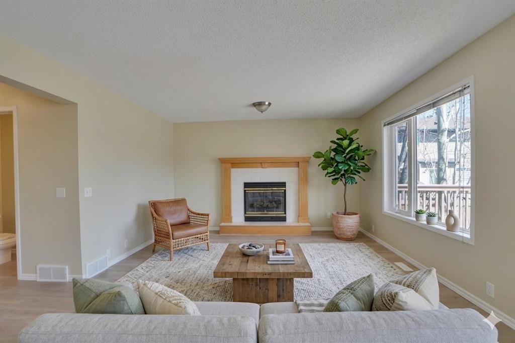 6 Somerset Close Sw, Calgary, AB - Indoor Photo Showing Living Room With Fireplace