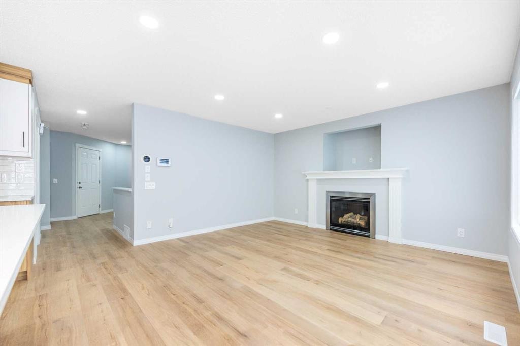 8454 Saddleridge Drive Ne, Calgary, AB - Indoor Photo Showing Living Room With Fireplace