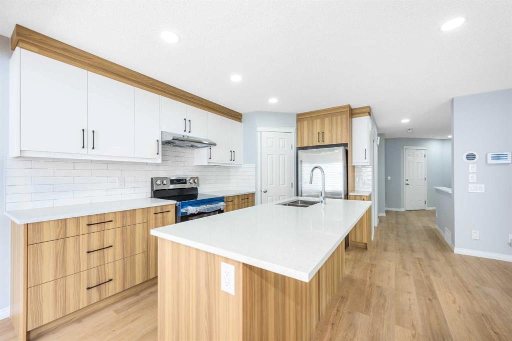 8454 Saddleridge Drive Ne, Calgary, AB - Indoor Photo Showing Kitchen With Double Sink With Upgraded Kitchen