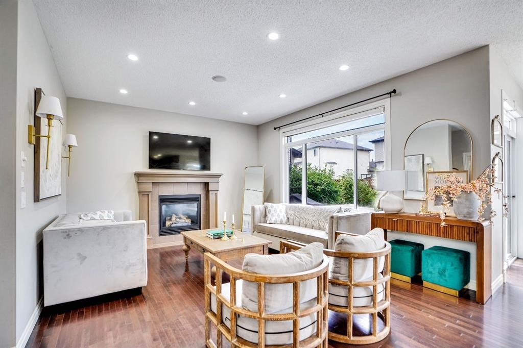117 Hawkmere Place, Chestermere, AB - Indoor Photo Showing Living Room With Fireplace