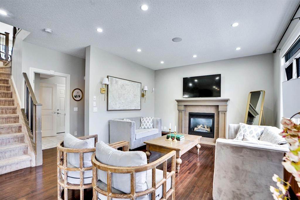 117 Hawkmere Place, Chestermere, AB - Indoor Photo Showing Living Room With Fireplace