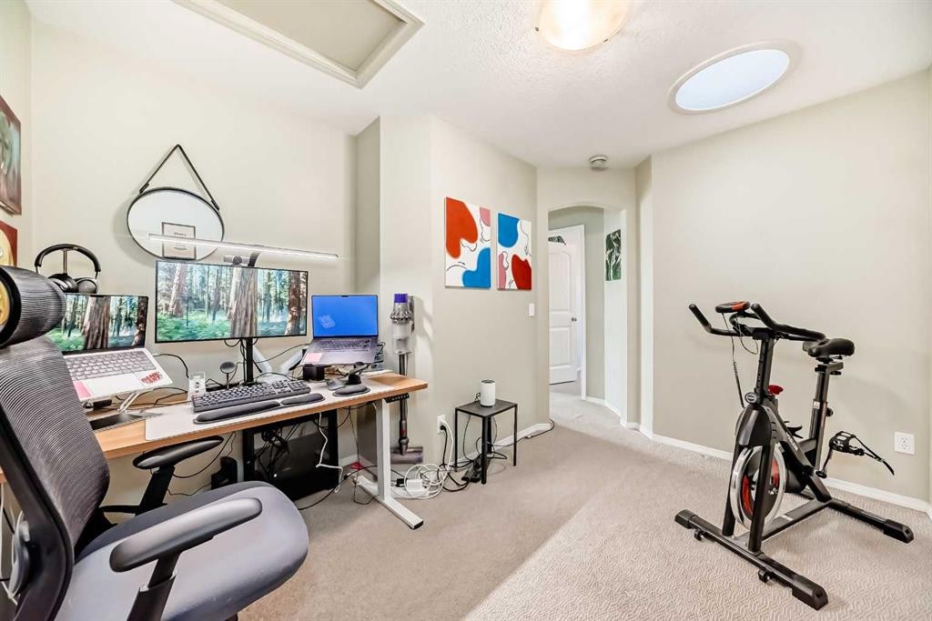 205-20 Panatella Landing Nw, Calgary, AB - Indoor Photo Showing Gym Room