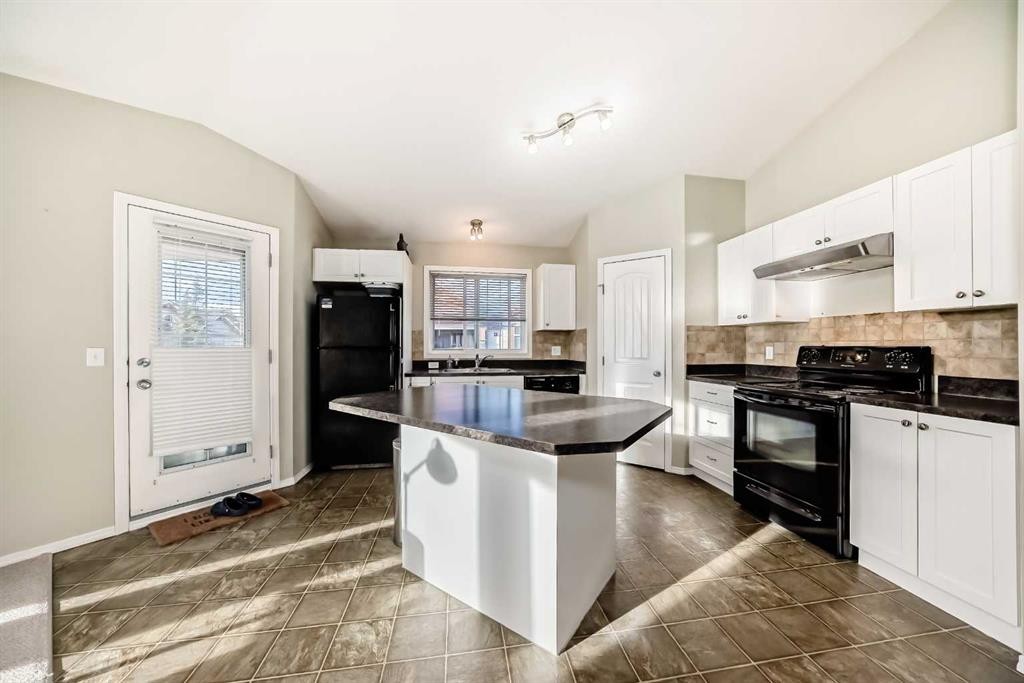 205-20 Panatella Landing Nw, Calgary, AB - Indoor Photo Showing Kitchen With Double Sink