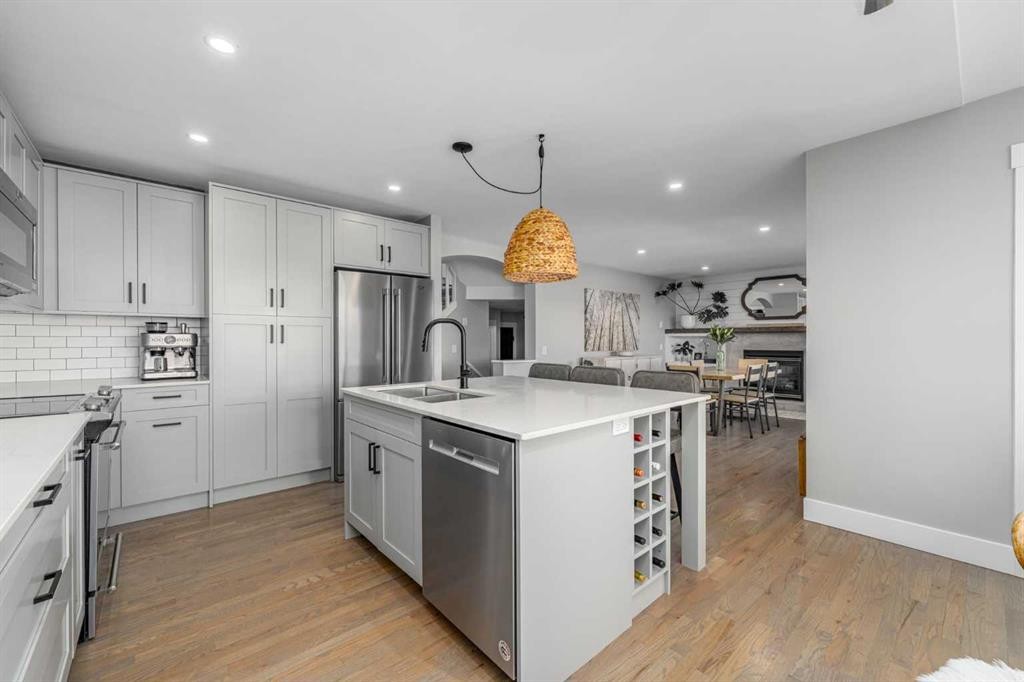 8 Sheep River Hill, Okotoks, AB - Indoor Photo Showing Kitchen With Stainless Steel Kitchen With Double Sink With Upgraded Kitchen