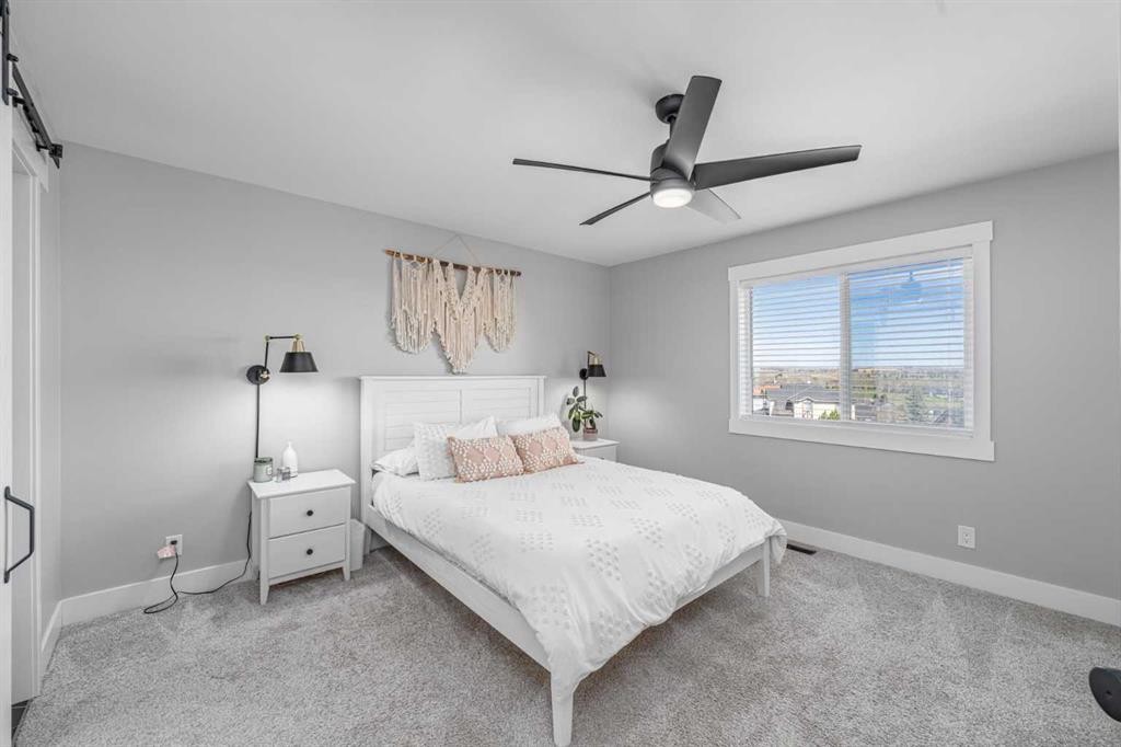 8 Sheep River Hill, Okotoks, AB - Indoor Photo Showing Bedroom
