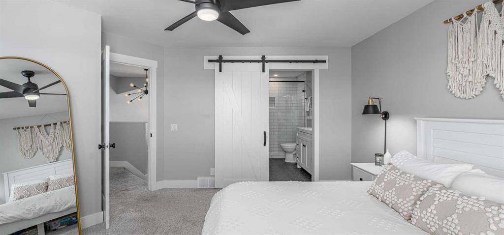 8 Sheep River Hill, Okotoks, AB - Indoor Photo Showing Bedroom