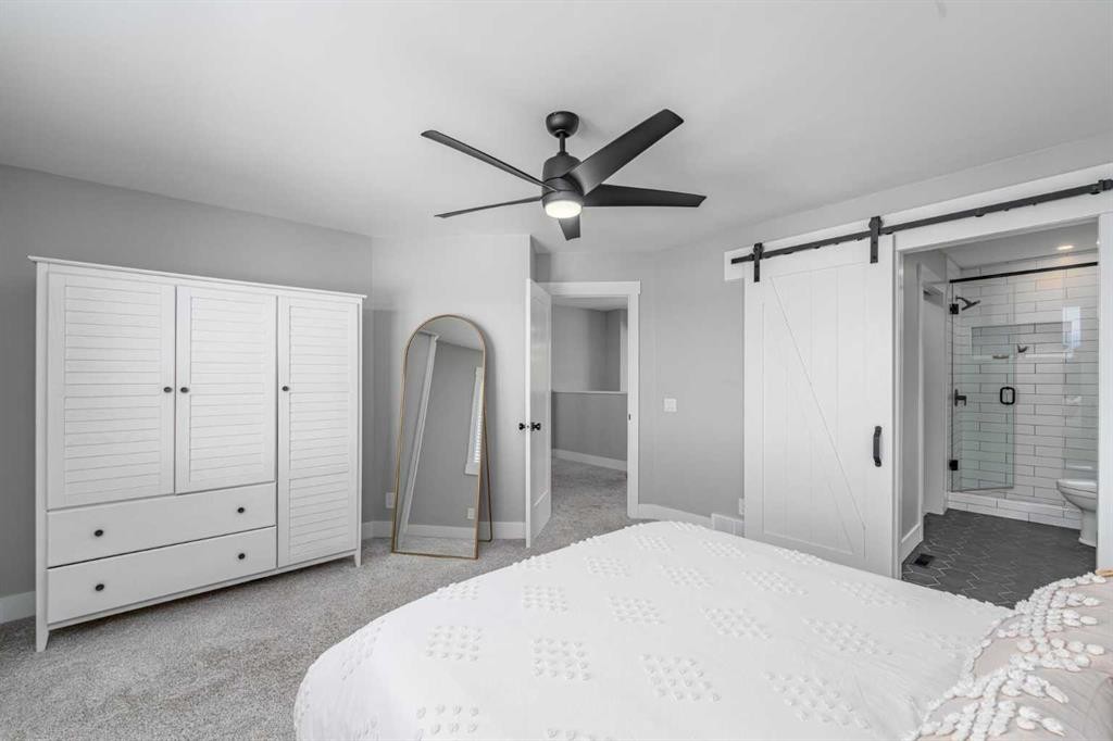 8 Sheep River Hill, Okotoks, AB - Indoor Photo Showing Bedroom