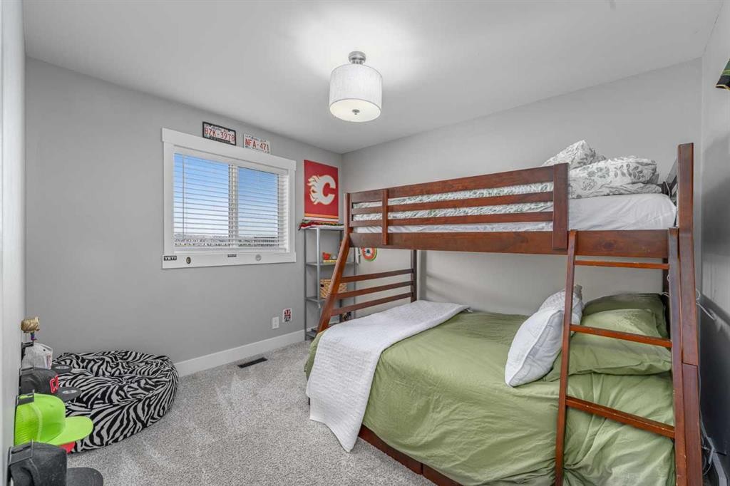 8 Sheep River Hill, Okotoks, AB - Indoor Photo Showing Bedroom