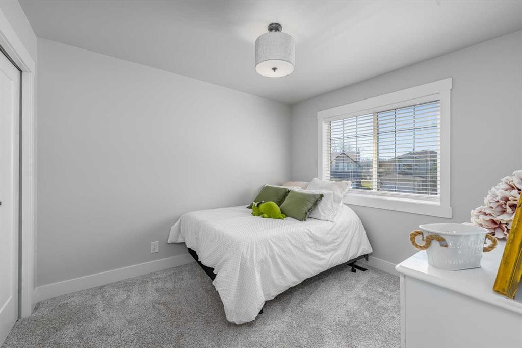 8 Sheep River Hill, Okotoks, AB - Indoor Photo Showing Bedroom