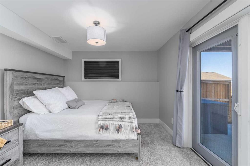 8 Sheep River Hill, Okotoks, AB - Indoor Photo Showing Bedroom