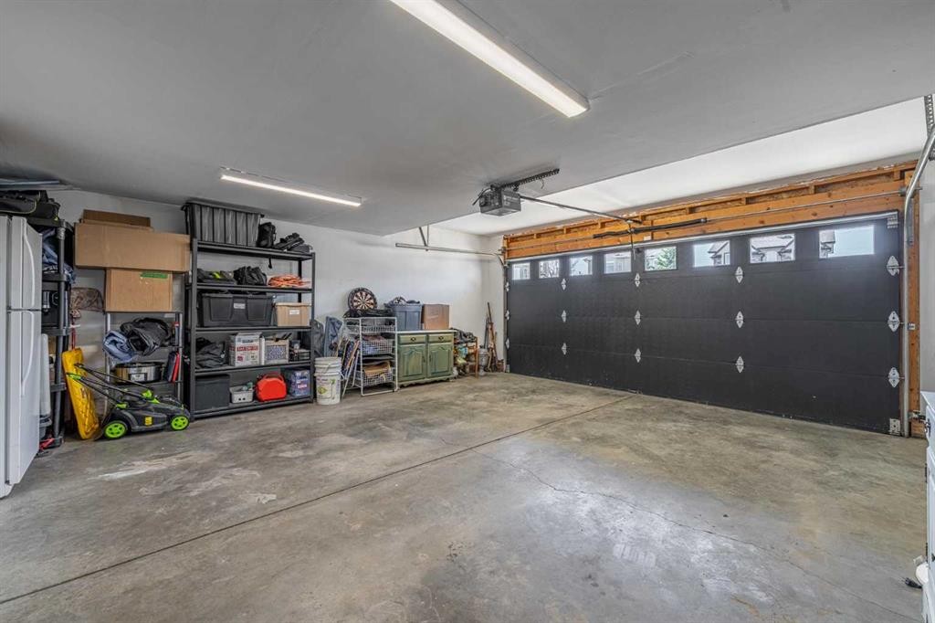 8 Sheep River Hill, Okotoks, AB - Indoor Photo Showing Garage