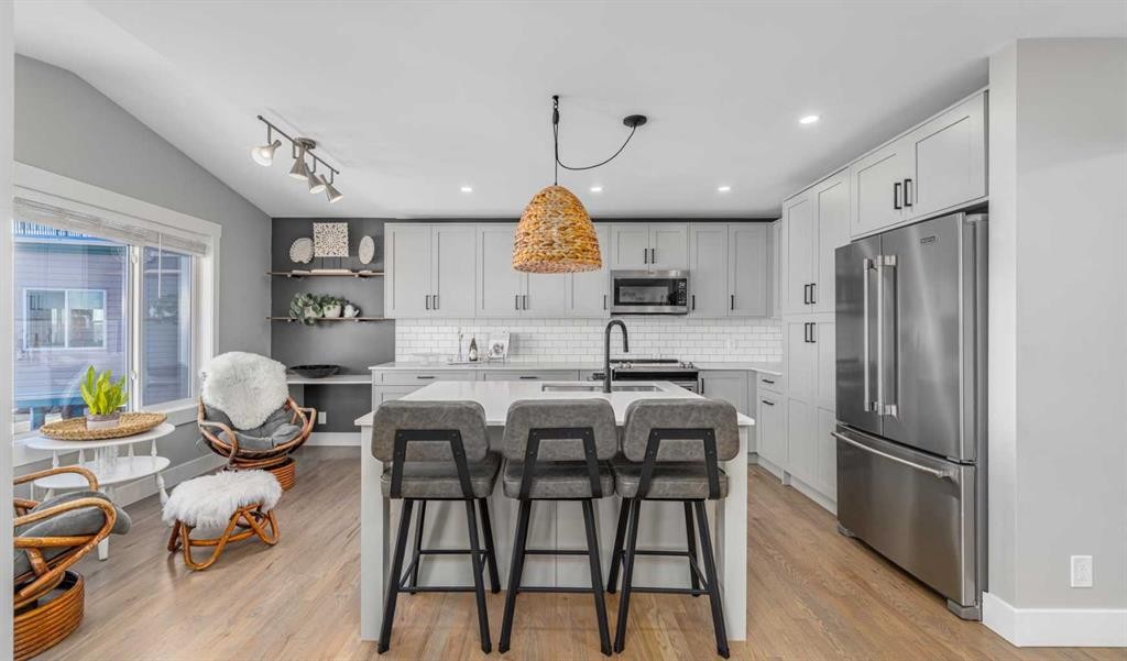 8 Sheep River Hill, Okotoks, AB - Indoor Photo Showing Kitchen With Stainless Steel Kitchen With Upgraded Kitchen