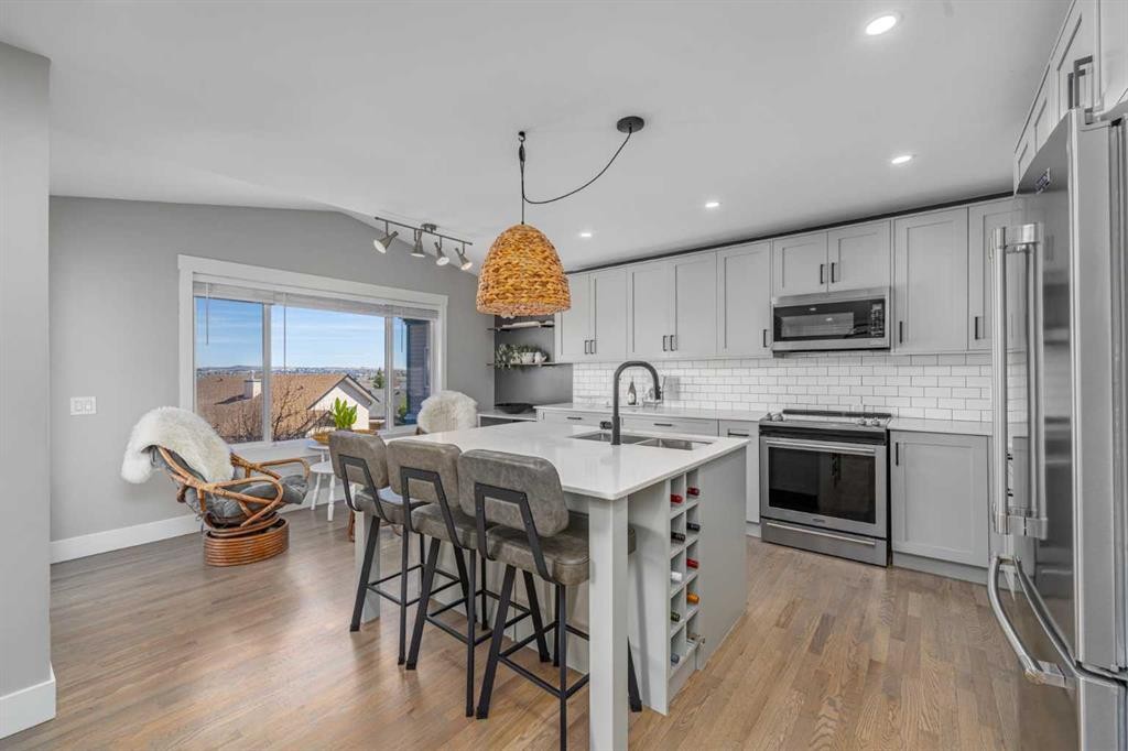 8 Sheep River Hill, Okotoks, AB - Indoor Photo Showing Kitchen With Stainless Steel Kitchen With Upgraded Kitchen