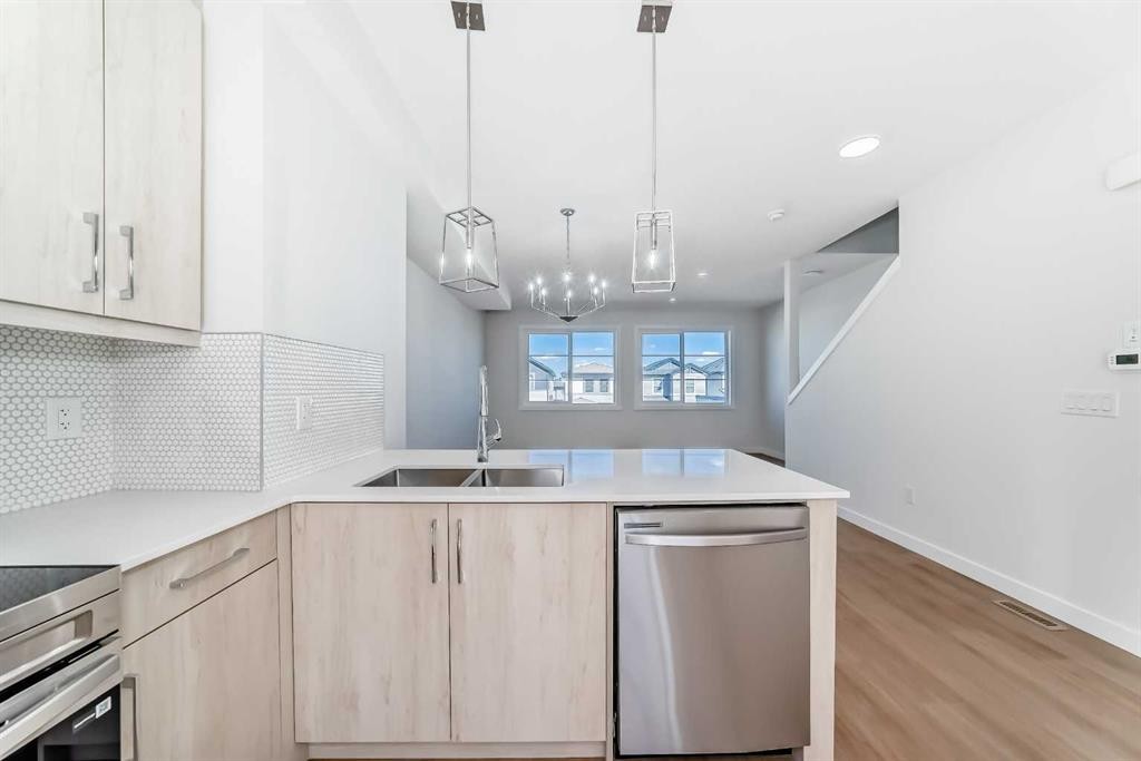 21 Cornergate Place Ne, Calgary, AB - Indoor Photo Showing Kitchen With Double Sink With Upgraded Kitchen