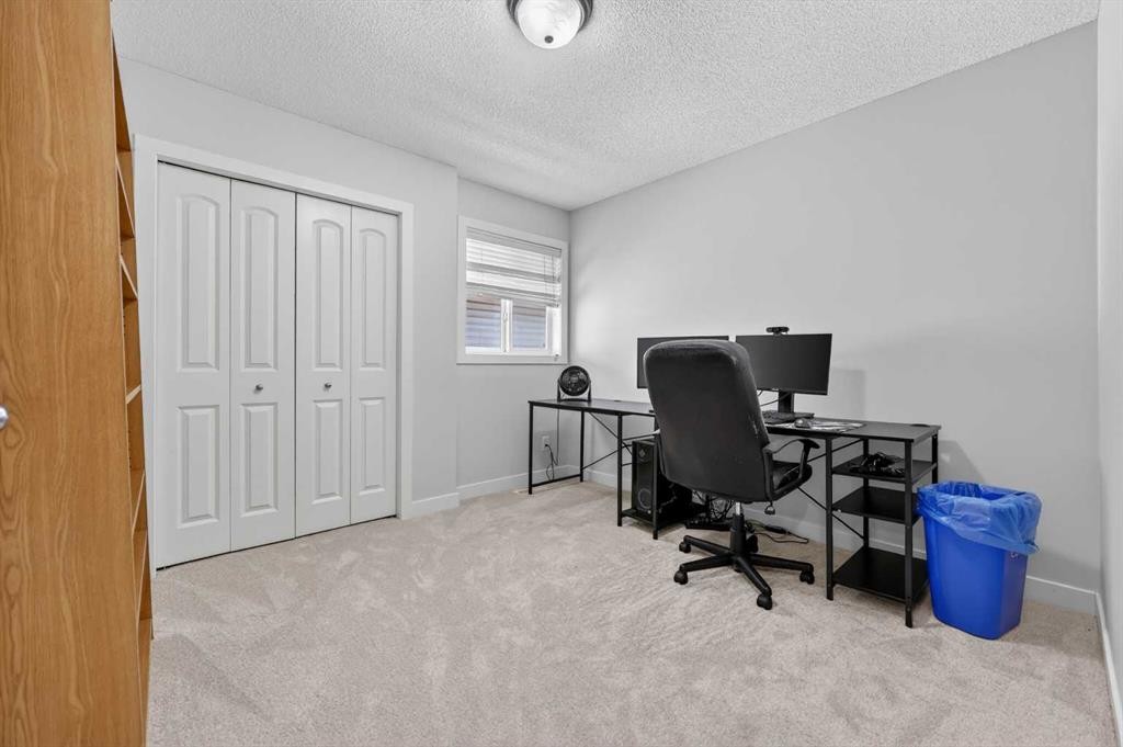 64 Cranridge Crescent Se, Calgary, AB - Indoor Photo Showing Bedroom