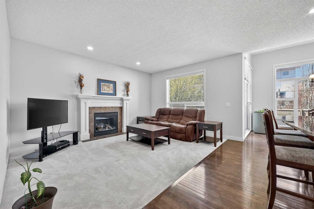 64 Cranridge Crescent Se, Calgary, AB - Indoor Photo Showing Living Room With Fireplace