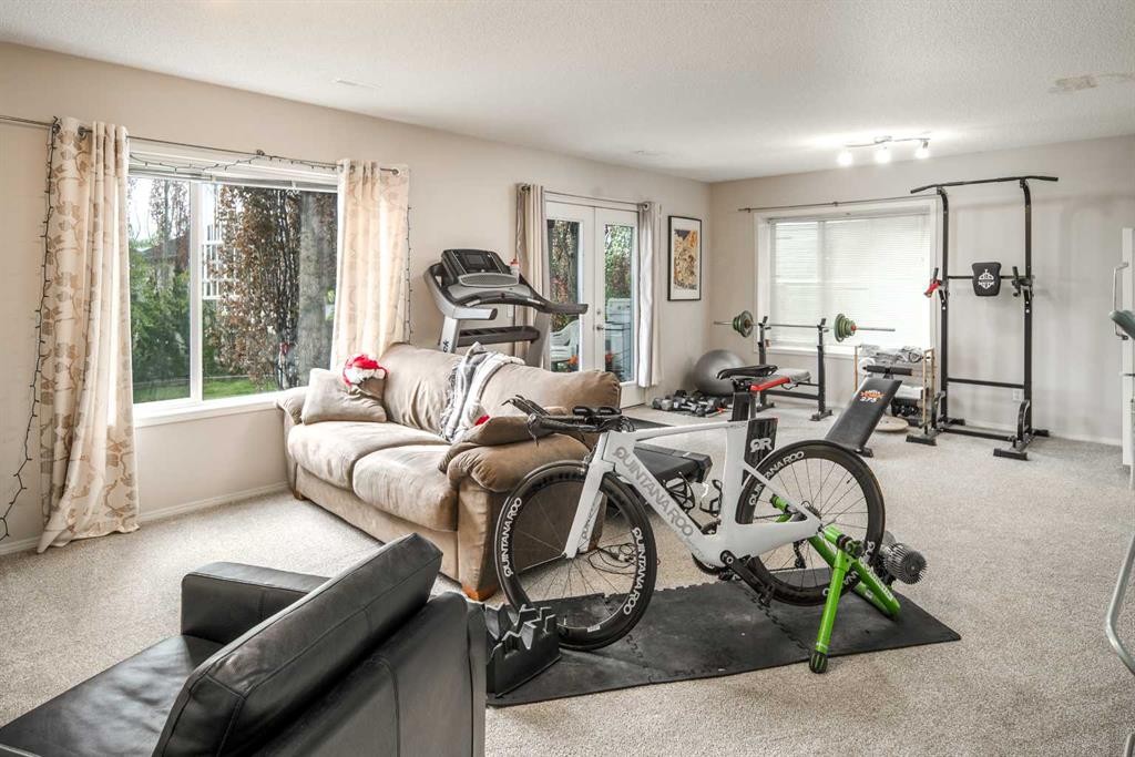 4 Springbank Bay Sw, Calgary, AB - Indoor Photo Showing Gym Room