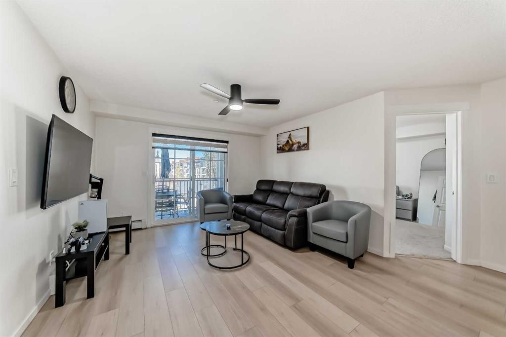 1312-755 Copperpond Boulevard Se, Calgary, AB - Indoor Photo Showing Living Room