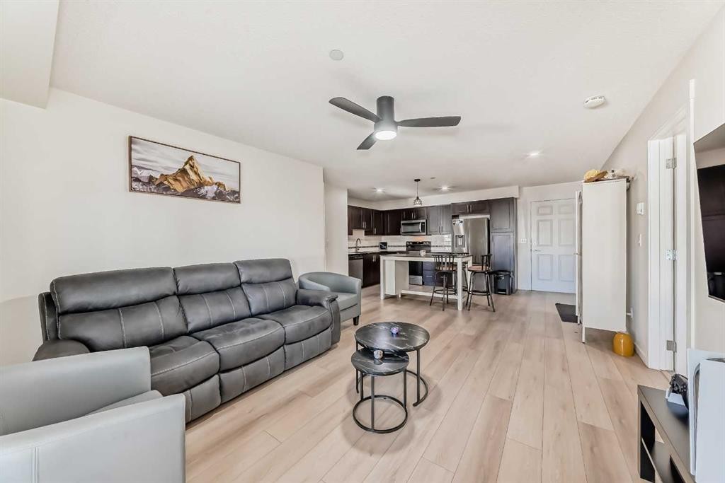 1312-755 Copperpond Boulevard Se, Calgary, AB - Indoor Photo Showing Living Room