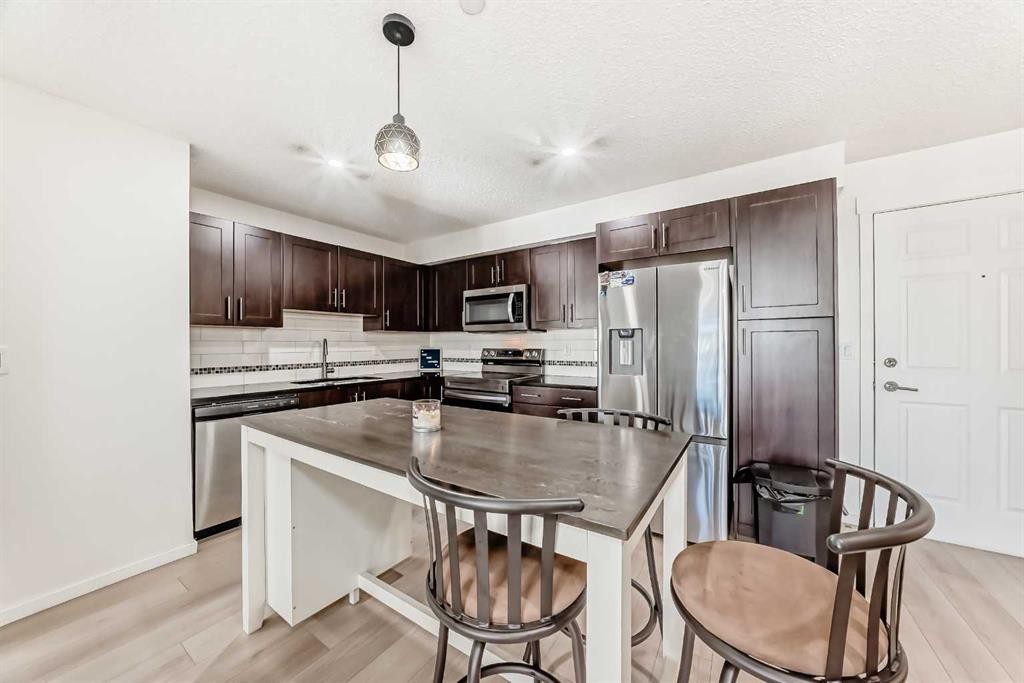 1312-755 Copperpond Boulevard Se, Calgary, AB - Indoor Photo Showing Kitchen