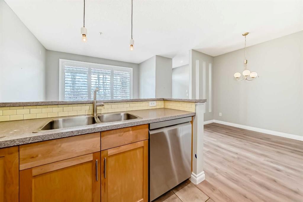 2-132 Rockyledge View Nw, Calgary, AB - Indoor Photo Showing Kitchen With Double Sink