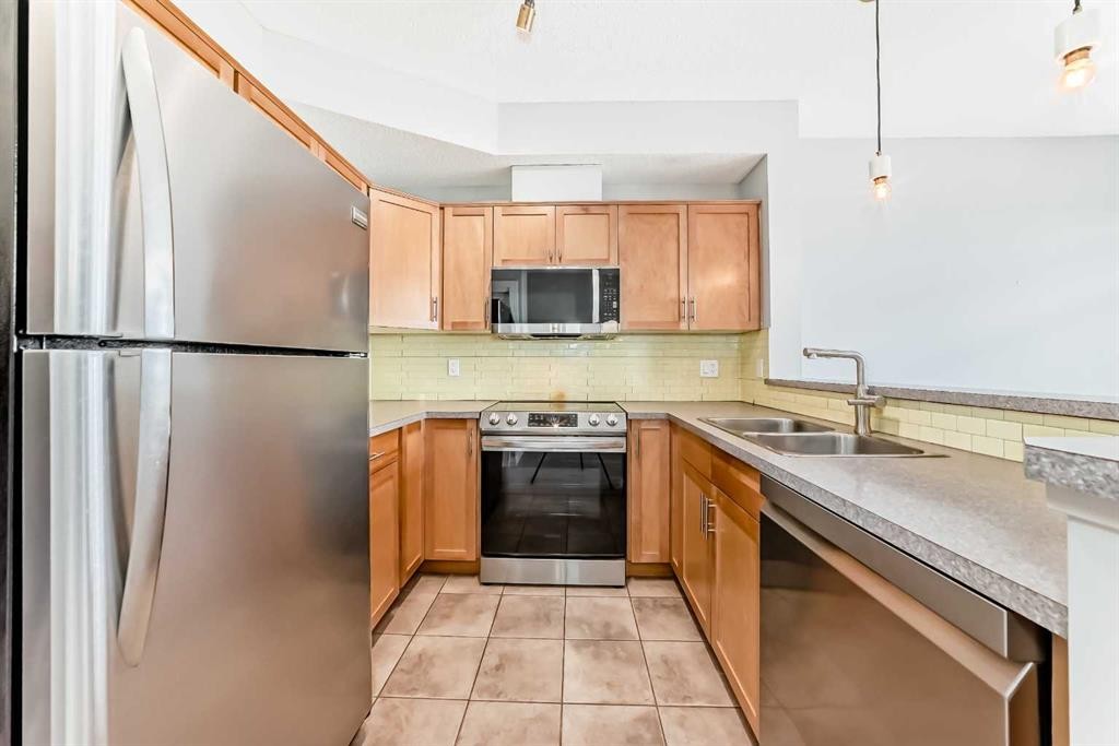 2-132 Rockyledge View Nw, Calgary, AB - Indoor Photo Showing Kitchen With Double Sink