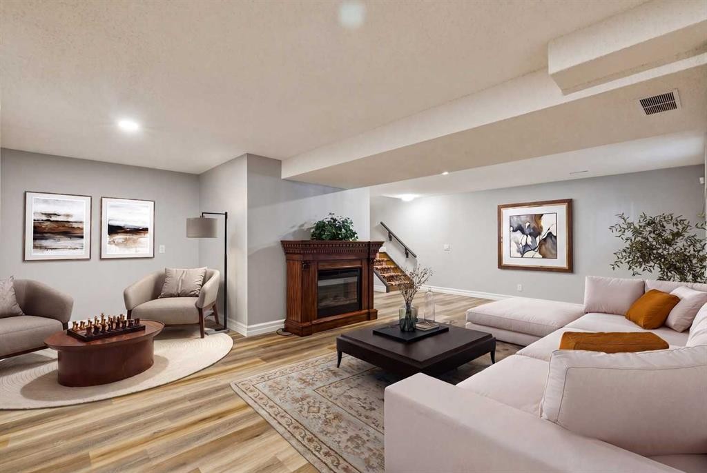 256 Sirocco Place Sw, Calgary, AB - Indoor Photo Showing Living Room With Fireplace