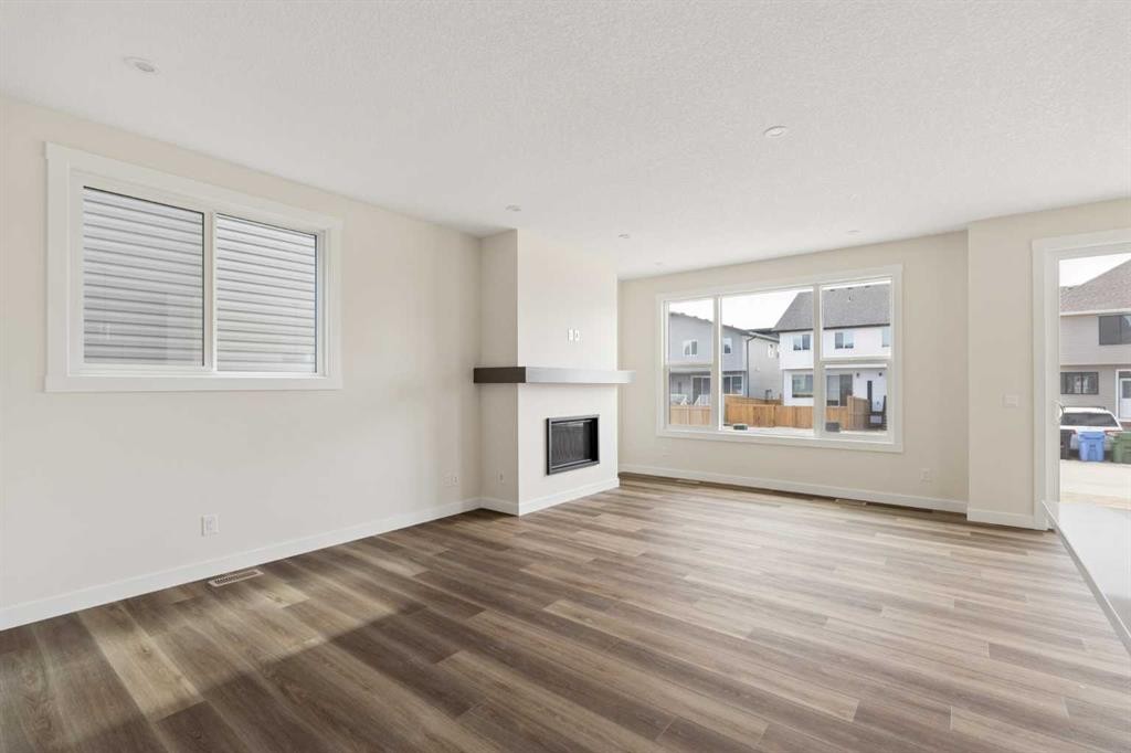 120 Creekstone Circle Sw, Calgary, AB - Indoor Photo Showing Living Room With Fireplace