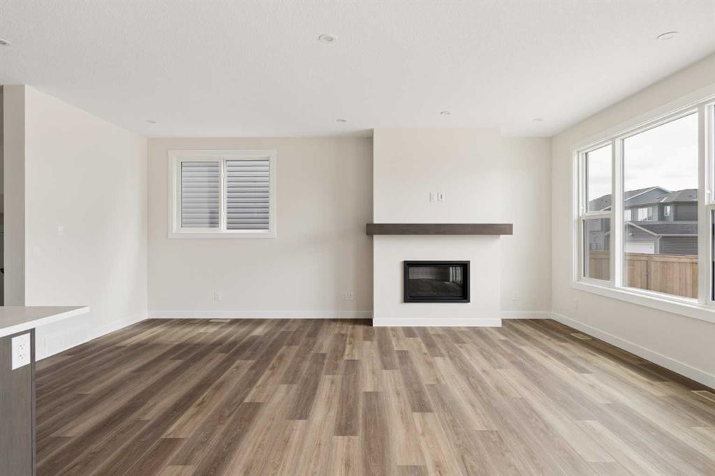 120 Creekstone Circle Sw, Calgary, AB - Indoor Photo Showing Living Room With Fireplace