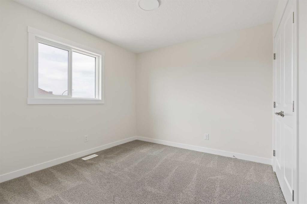 120 Creekstone Circle Sw, Calgary, AB - Indoor Photo Showing Other Room
