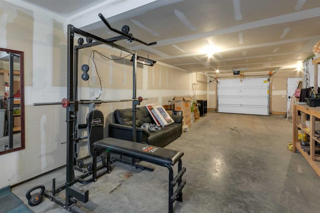 188 Sundown Road, Cochrane, AB - Indoor Photo Showing Garage
