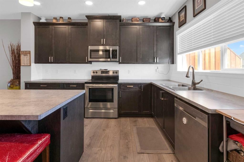 188 Sundown Road, Cochrane, AB - Indoor Photo Showing Kitchen With Stainless Steel Kitchen With Double Sink