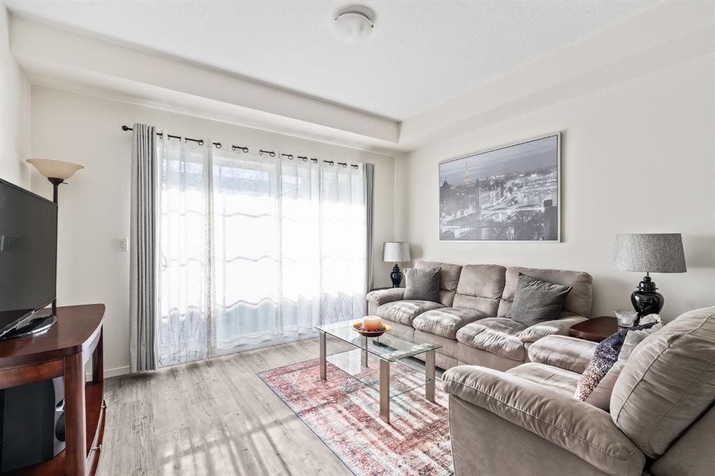 6302-151 Legacy Main Street Se, Calgary, AB - Indoor Photo Showing Living Room